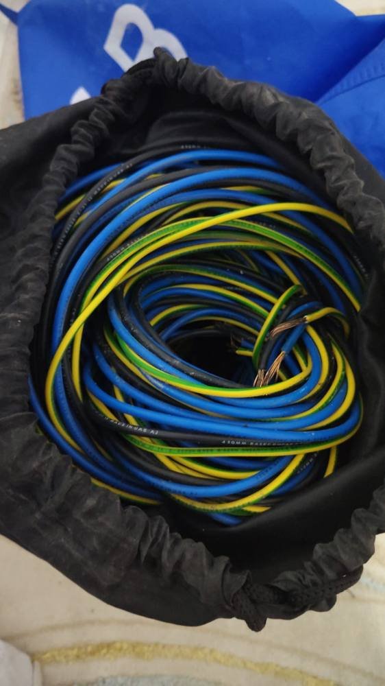 Coil of blue and yellow copper wire scrap