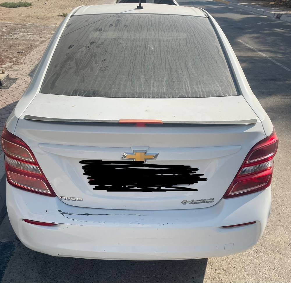 Damaged white sedan sold for scrap