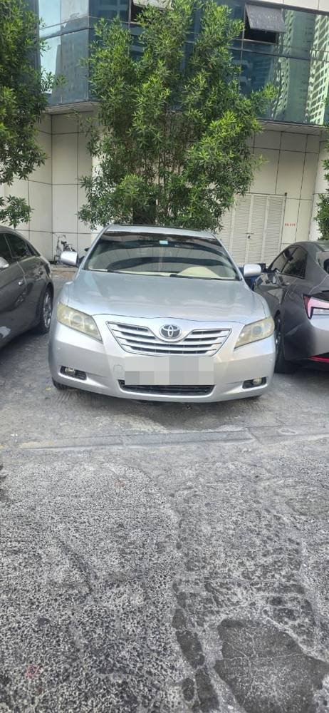 Old silver sedan available as scrap car